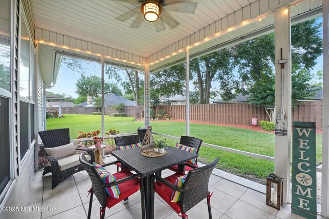 1077 Waterfall Dr, Jacksonville, FL 32225 - sunroom featuring a ceiling fan and outdoor dining space