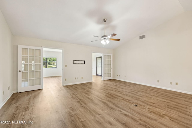 4580 Carolyn Cove Ln N, Jacksonville, FL 32258 - empty room featuring lofted ceiling, wood finished floors, ceiling fan, french doors, and baseboards