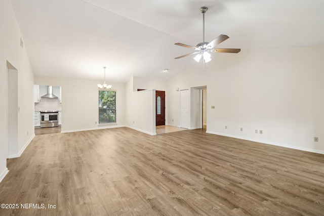 4580 Carolyn Cove Ln N, Jacksonville, FL 32258 - unfurnished living room featuring a chandelier, light wood-style flooring, a ceiling fan, baseboards, and high vaulted ceiling