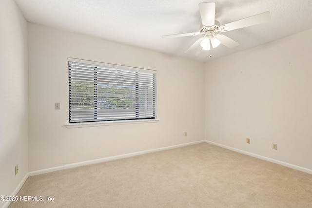 4580 Carolyn Cove Ln N, Jacksonville, FL 32258 - unfurnished room featuring light carpet, baseboards, and a ceiling fan