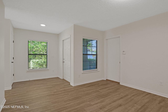 274 Syrah Way, Saint Augustine, FL 32084 - entrance foyer with light wood-type flooring, baseboards, a textured ceiling, and recessed lighting