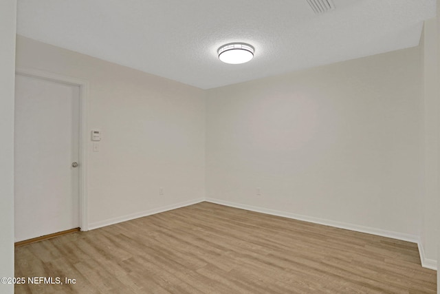 274 Syrah Way, Saint Augustine, FL 32084 - spare room with light wood finished floors, baseboards, and a textured ceiling