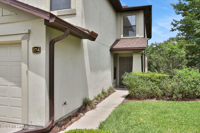 274 Syrah Way, Saint Augustine, FL 32084 - doorway to property featuring stucco siding
