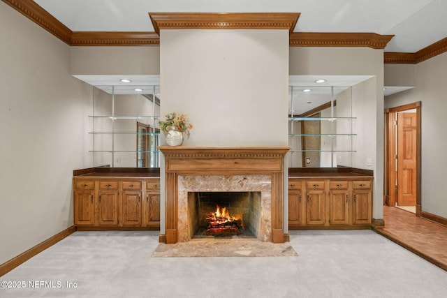 8127 Middle Fork Ln, Jacksonville, FL 32256 - living room with crown molding, light carpet, baseboards, a premium fireplace, and recessed lighting