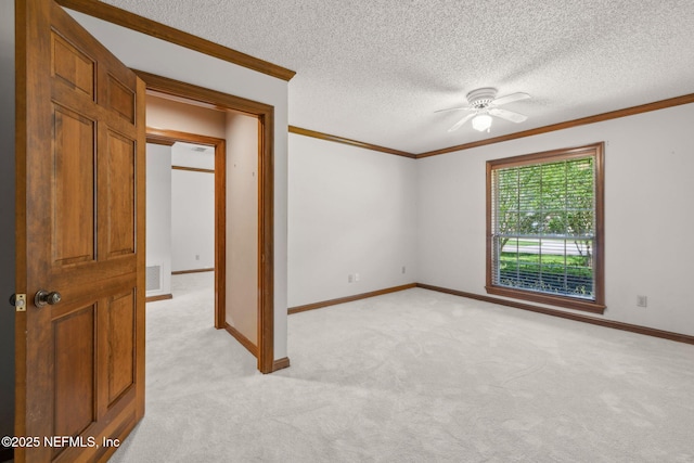 8127 Middle Fork Ln, Jacksonville, FL 32256 - unfurnished room featuring crown molding, a ceiling fan, light colored carpet, a textured ceiling, and baseboards