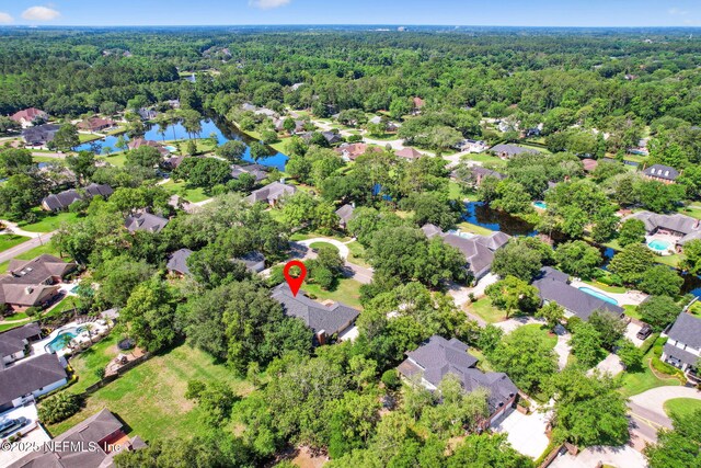 8127 Middle Fork Ln, Jacksonville, FL 32256 - aerial view of residential area with a forest and a nearby body of water