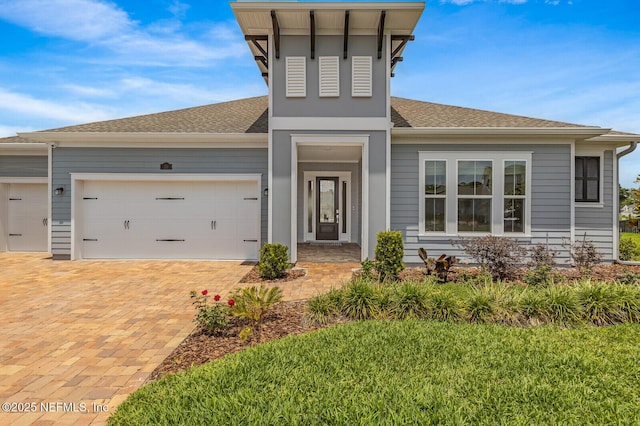 70 Pavo Cir, Saint Johns, FL 32259 - view of front of house with roof with shingles, a garage, and driveway