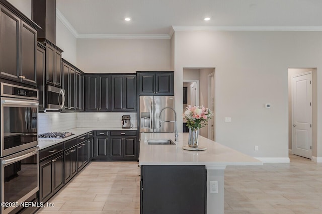 70 Pavo Cir, Saint Johns, FL 32259 - kitchen with appliances with stainless steel finishes, a sink, light countertops, decorative backsplash, and ornamental molding
