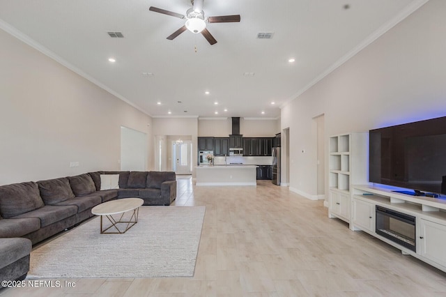 70 Pavo Cir, Saint Johns, FL 32259 - living area with ceiling fan, crown molding, recessed lighting, and baseboards