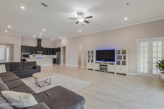 70 Pavo Cir, Saint Johns, FL 32259 - living area featuring ornamental molding, a ceiling fan, recessed lighting, baseboards, and a chandelier