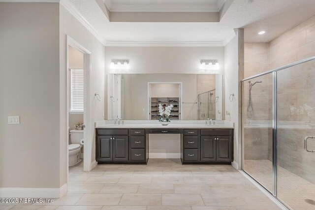70 Pavo Cir, Saint Johns, FL 32259 - full bath with toilet, double vanity, a stall shower, crown molding, and a spacious closet