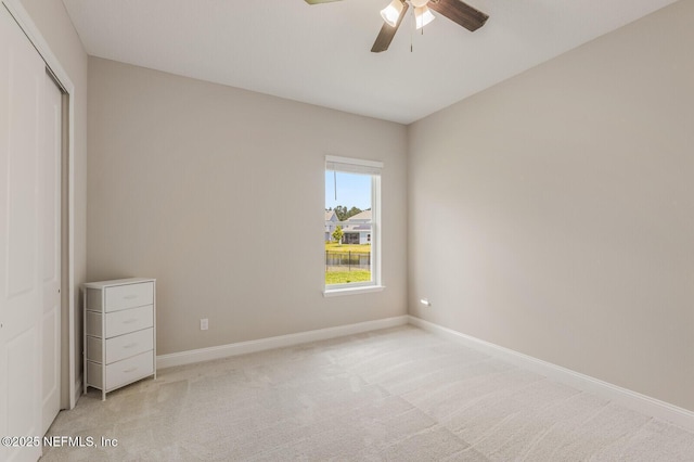 70 Pavo Cir, Saint Johns, FL 32259 - unfurnished bedroom featuring a closet, baseboards, light colored carpet, and a ceiling fan