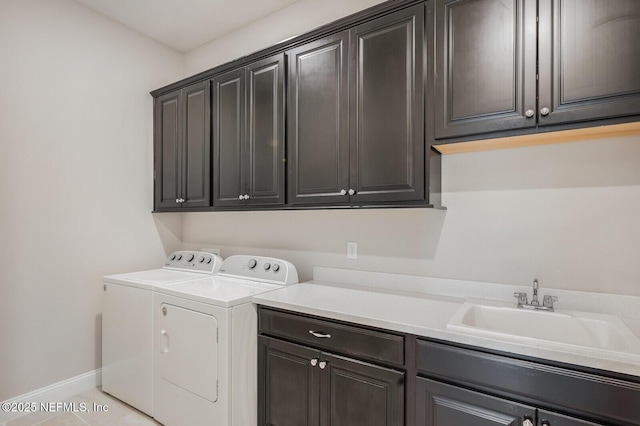 70 Pavo Cir, Saint Johns, FL 32259 - laundry room with cabinet space, washing machine and dryer, baseboards, and light tile patterned floors