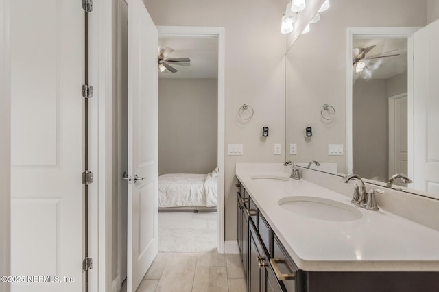 70 Pavo Cir, Saint Johns, FL 32259 - full bathroom with double vanity, a ceiling fan, ensuite bath, and baseboards