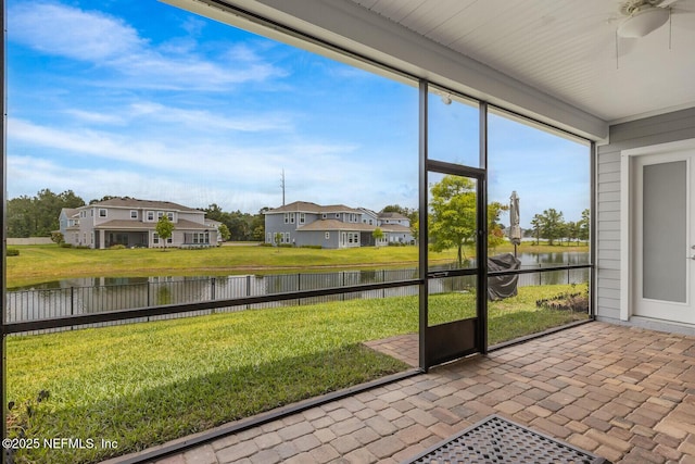 70 Pavo Cir, Saint Johns, FL 32259 - unfurnished sunroom featuring ceiling fan, a water view, and a residential view
