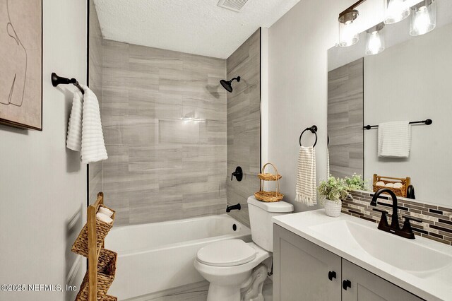 521 Talbot Ave, Jacksonville, FL 32205 - bathroom with toilet, vanity, shower / tub combination, decorative backsplash, and a textured ceiling