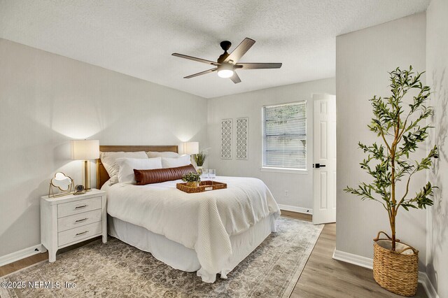 521 Talbot Ave, Jacksonville, FL 32205 - bedroom featuring wood finished floors, baseboards, a textured ceiling, and ceiling fan