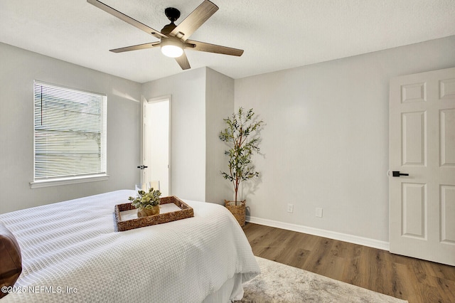 521 Talbot Ave, Jacksonville, FL 32205 - bedroom with wood finished floors, baseboards, and ceiling fan