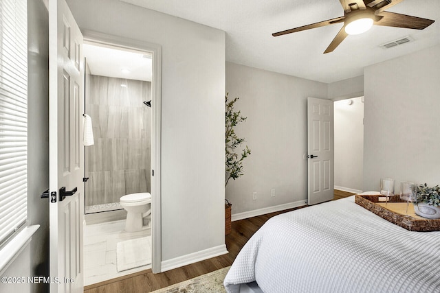 521 Talbot Ave, Jacksonville, FL 32205 - bedroom with baseboards, wood finished floors, ensuite bathroom, and a ceiling fan