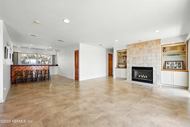 2605 S Ponte Vedra Blvd, Ponte Vedra Beach, FL 32082 - living area featuring built in features, a fireplace, baseboards, and recessed lighting