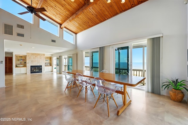 2605 S Ponte Vedra Blvd, Ponte Vedra Beach, FL 32082 - dining area featuring wooden ceiling with exposed beams, high vaulted ceiling, healthy amount of natural light, ceiling fan, and a tiled fireplace
