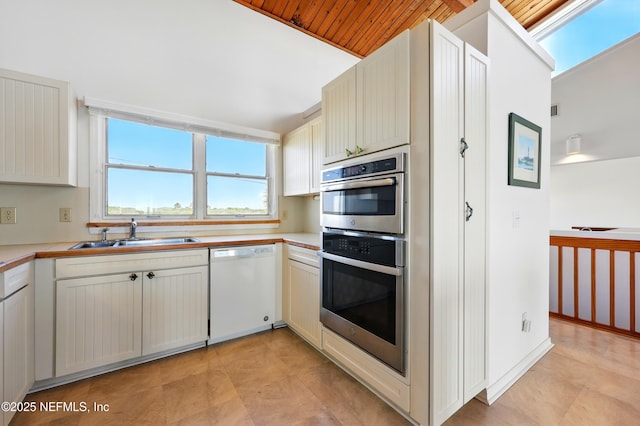 2605 S Ponte Vedra Blvd, Ponte Vedra Beach, FL 32082 - kitchen featuring white dishwasher, a sink, double oven, and light countertops