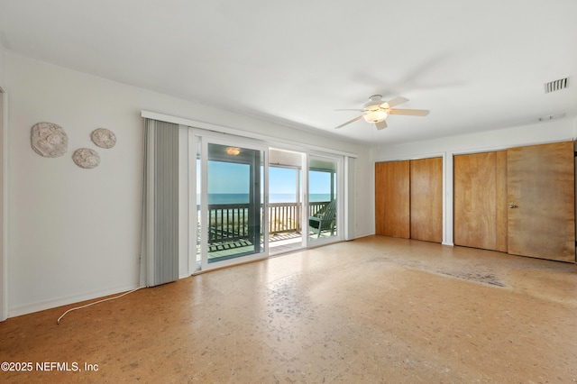 2605 S Ponte Vedra Blvd, Ponte Vedra Beach, FL 32082 - unfurnished bedroom with access to outside, two closets, and a ceiling fan