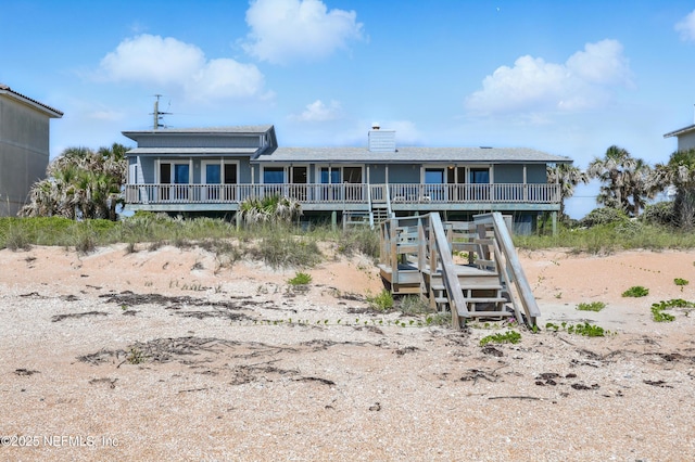 2605 S Ponte Vedra Blvd, Ponte Vedra Beach, FL 32082 - back of house featuring a wooden deck, a chimney, and stairs