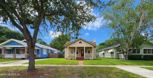 3675 Oak St, Jacksonville, FL 32205 - view of front facade featuring a porch and a chimney
