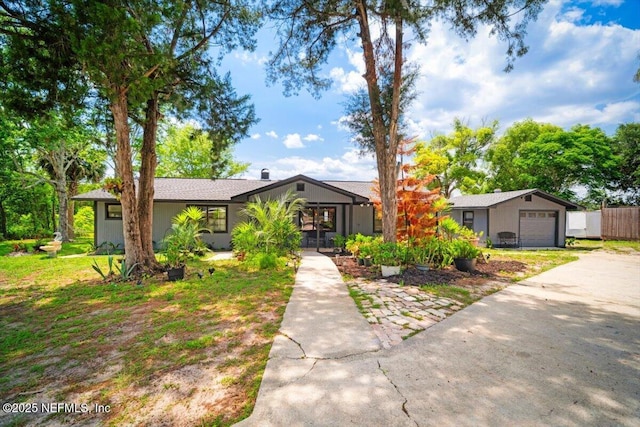 153 Jaffa Rd, Crescent City, FL 32112 - view of front of house featuring an attached garage and concrete driveway