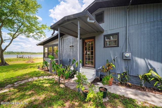 153 Jaffa Rd, Crescent City, FL 32112 - doorway to property featuring a water view and a lawn