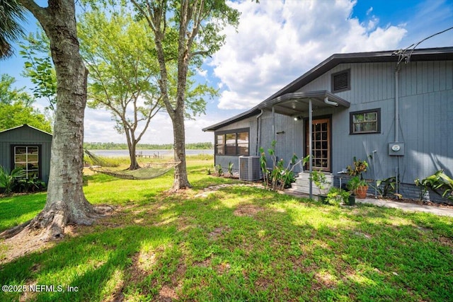 153 Jaffa Rd, Crescent City, FL 32112 - view of green lawn featuring central air condition unit