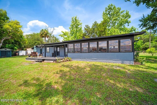 153 Jaffa Rd, Crescent City, FL 32112 - rear view of property with a deck and a yard