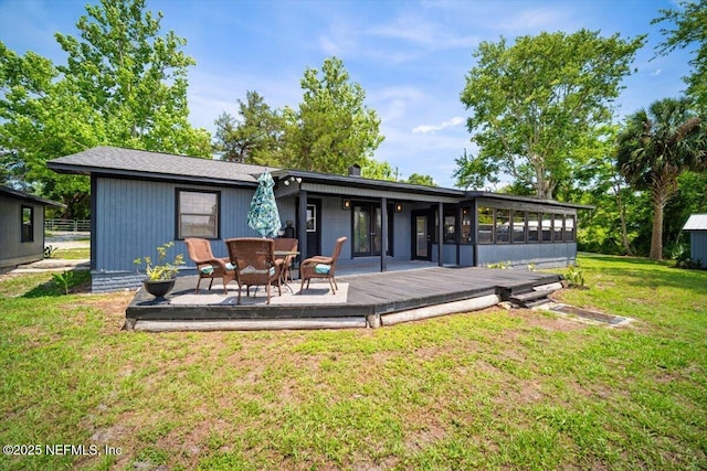 153 Jaffa Rd, Crescent City, FL 32112 - rear view of property featuring a sunroom, a wooden deck, and a yard