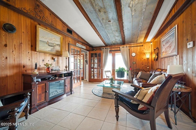 153 Jaffa Rd, Crescent City, FL 32112 - living area featuring wood walls, light tile patterned floors, and french doors