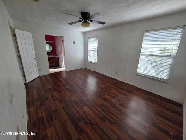 2 Bonita Dr, Ponte Vedra Beach, FL 32082 - unfurnished bedroom featuring wood finished floors, a textured ceiling, and ensuite bath