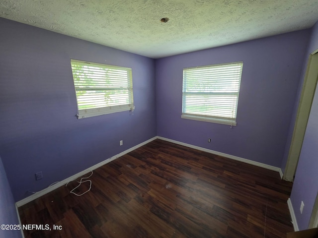 2 Bonita Dr, Ponte Vedra Beach, FL 32082 - empty room with dark wood finished floors and a textured ceiling