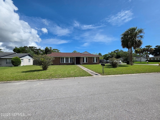 2 Bonita Dr, Ponte Vedra Beach, FL 32082 - single story home featuring a front lawn, driveway, and brick siding