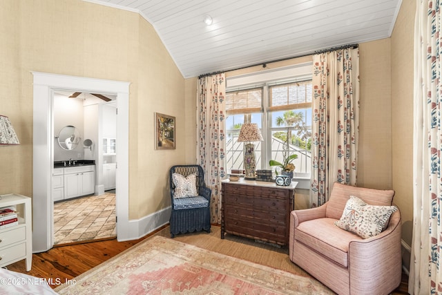 102 Palm Pl, Neptune Beach, FL 32266 - sitting room featuring vaulted ceiling, wood finished floors, and baseboards