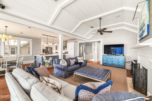 102 Palm Pl, Neptune Beach, FL 32266 - living area featuring ceiling fan, a chandelier, baseboards, and ornate columns