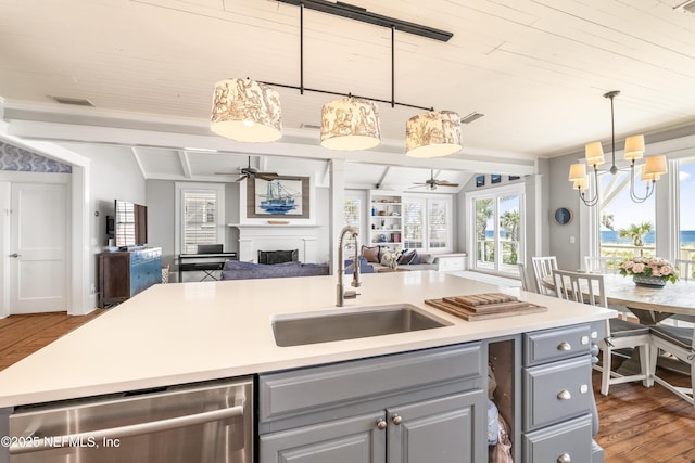 102 Palm Pl, Neptune Beach, FL 32266 - kitchen with gray cabinetry, open floor plan, a sink, a ceiling fan, and dishwasher