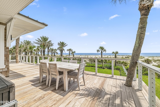 102 Palm Pl, Neptune Beach, FL 32266 - wooden terrace featuring view of water and beach and outdoor dining area