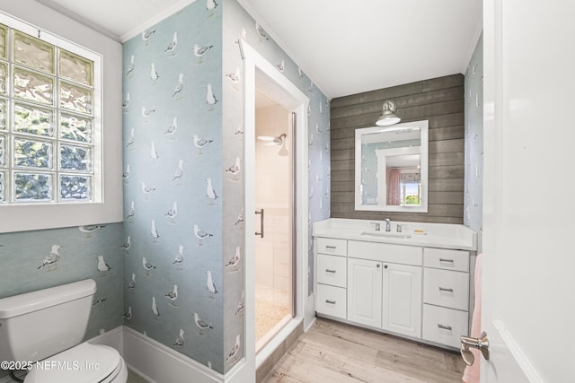 102 Palm Pl, Neptune Beach, FL 32266 - bathroom featuring a stall shower, plenty of natural light, wood finished floors, vanity, and ornamental molding