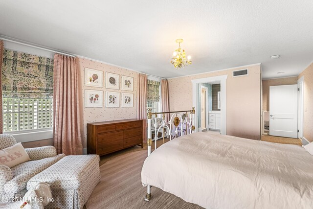 102 Palm Pl, Neptune Beach, FL 32266 - bedroom featuring a chandelier, multiple windows, and light colored carpet