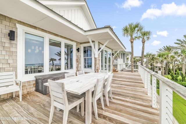 102 Palm Pl, Neptune Beach, FL 32266 - wooden terrace with outdoor dining space