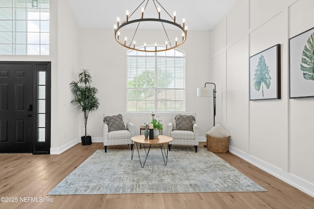 1008 Durbin Parke Dr, Saint Johns, FL 32259 - living area featuring a chandelier, wood finished floors, and baseboards