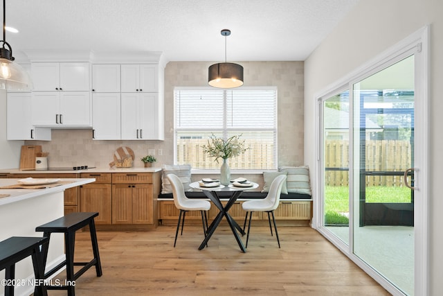 1008 Durbin Parke Dr, Saint Johns, FL 32259 - dining room featuring light wood-type flooring and a textured ceiling
