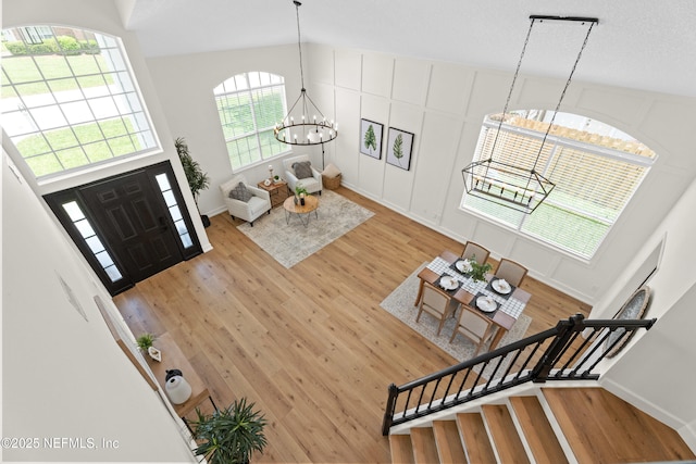 1008 Durbin Parke Dr, Saint Johns, FL 32259 - foyer featuring a chandelier, light wood-style flooring, stairway, and baseboards