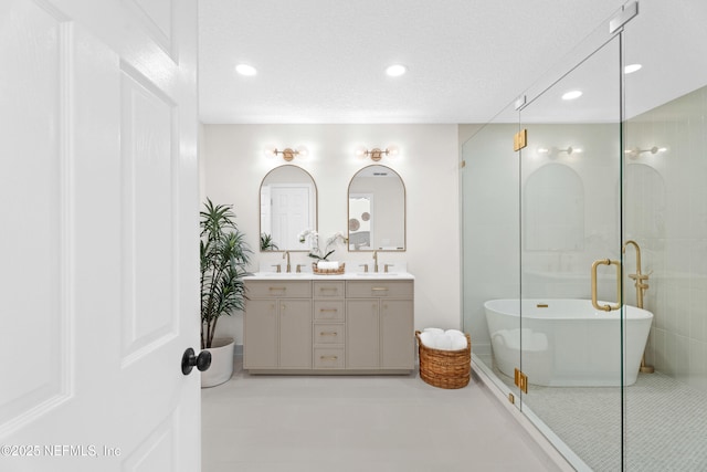 1008 Durbin Parke Dr, Saint Johns, FL 32259 - full bath featuring a soaking tub, double vanity, recessed lighting, tile patterned flooring, and an enclosed shower