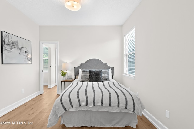 1008 Durbin Parke Dr, Saint Johns, FL 32259 - bedroom featuring wood finished floors, multiple windows, and baseboards